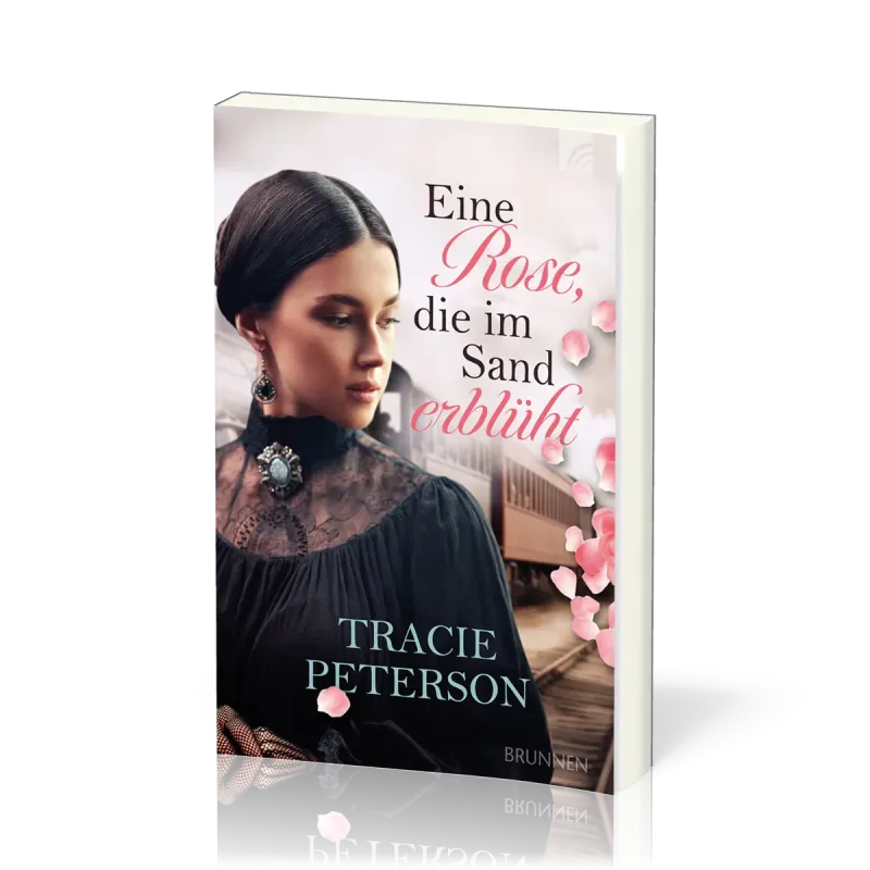 Eine Rose, die im Sand erblüht